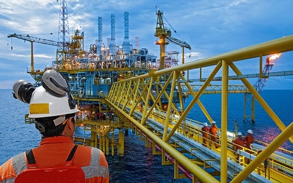 Back of offshore worker working on a job at sea. Offshore industry could benefit from IR35 by retaining skilled contractors on a permanent basis