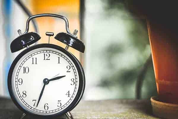 Meeting deadlines as a freelancer - Black round alarm clock