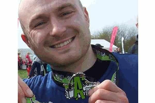 Simon with his medal following the Insane Terrain run.