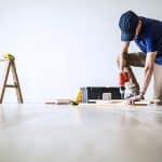 Tradesman completing job with tools on site