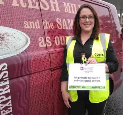 Field Service Engineer for Costa, Laura Angel, stood in front of a work van.