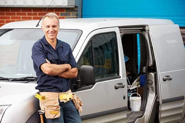 tradesman with his work van