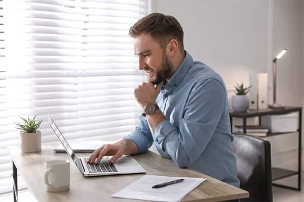 Project Manager sat at desk