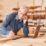 tradesman on phone for trades insurance quote